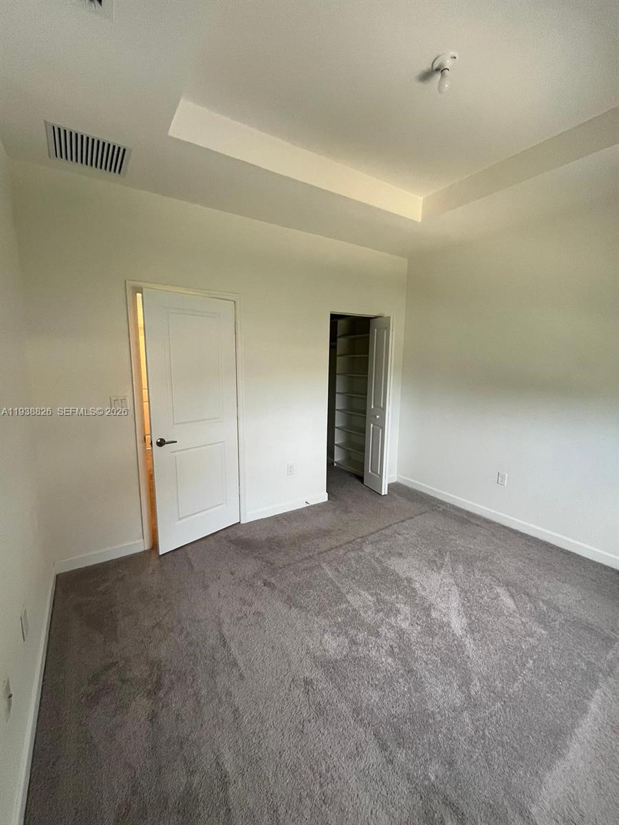 9941 Southwest 228th Terrace, Unit 9941 Miami, FL 33190 - Photo 17 of 31 a view of an empty room