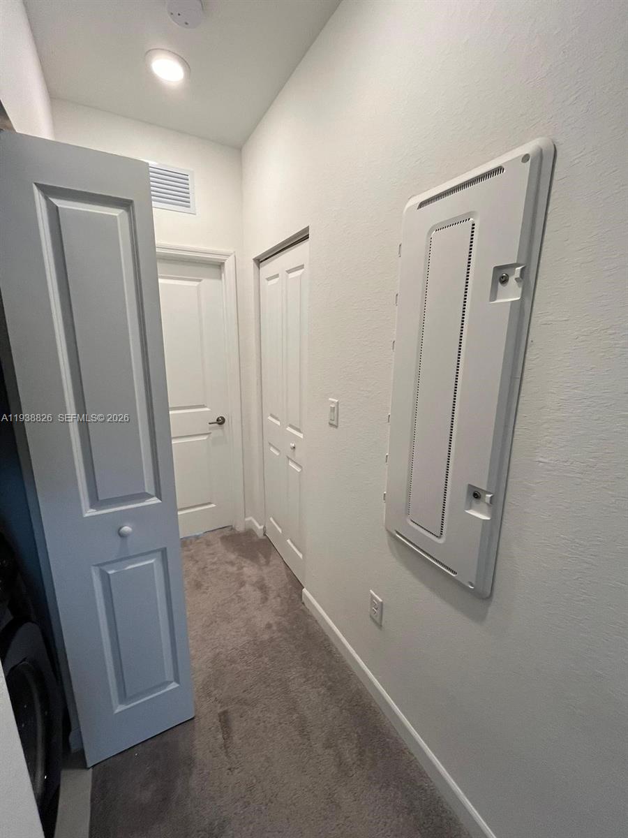 9941 Southwest 228th Terrace, Unit 9941 Miami, FL 33190 - Photo 23 of 31 an empty room with windows