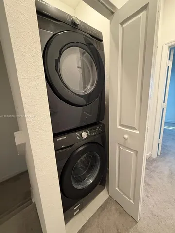 a view of a storage & utility room with washer and dryer