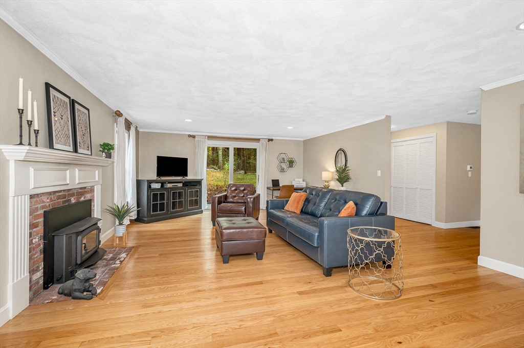 4 Coleman Road Newbury, MA 01922 - Photo 16 of 42 a living room with furniture and a fireplace