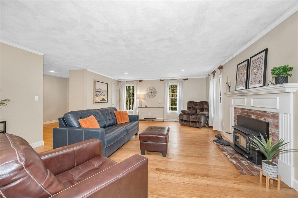 4 Coleman Road Newbury, MA 01922 - Photo 17 of 42 a living room with furniture and a fireplace