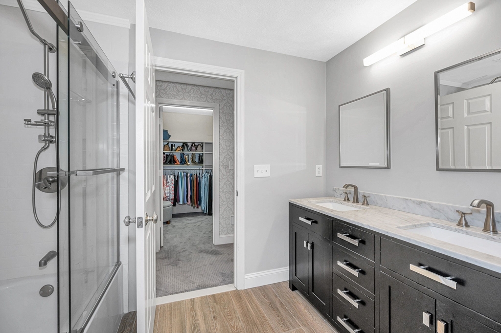 4 Coleman Road Newbury, MA 01922 - Photo 23 of 42 a bathroom with a shower sink and mirror