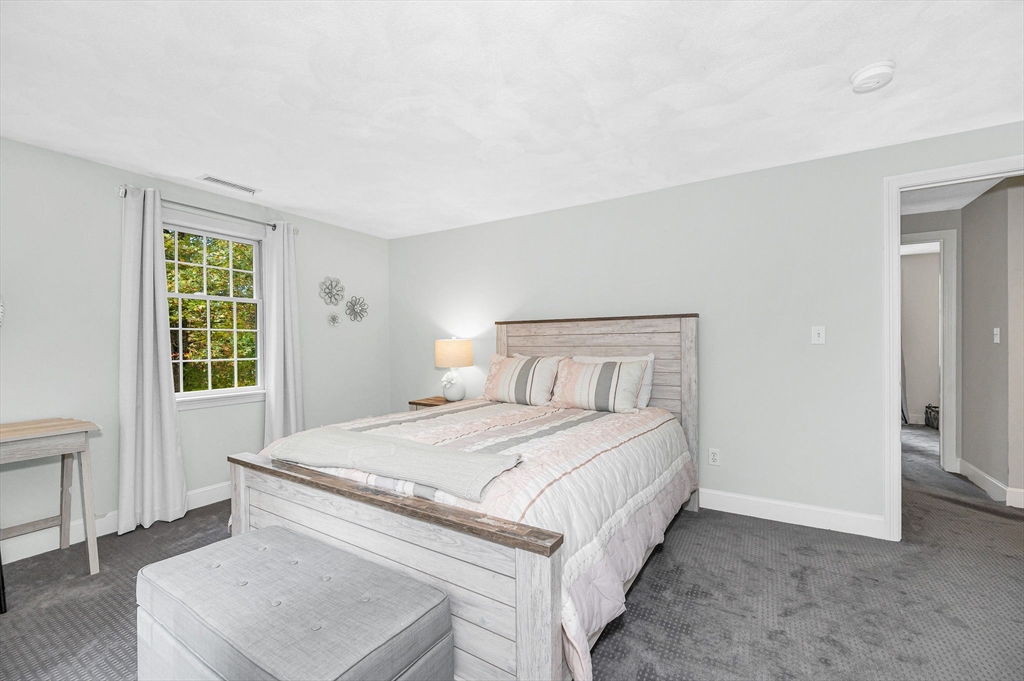 4 Coleman Road Newbury, MA 01922 - Photo 26 of 42 a bedroom with a bed and a window