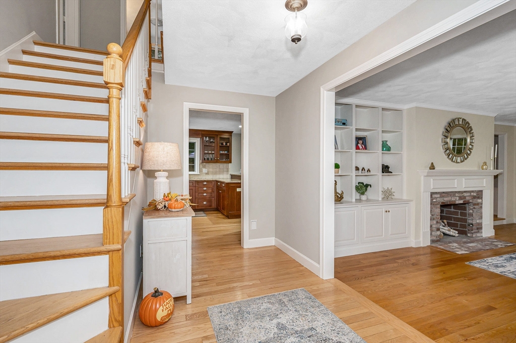 4 Coleman Road Newbury, MA 01922 - Photo 3 of 42 a view of a livingroom with wooden floor and a fireplace
