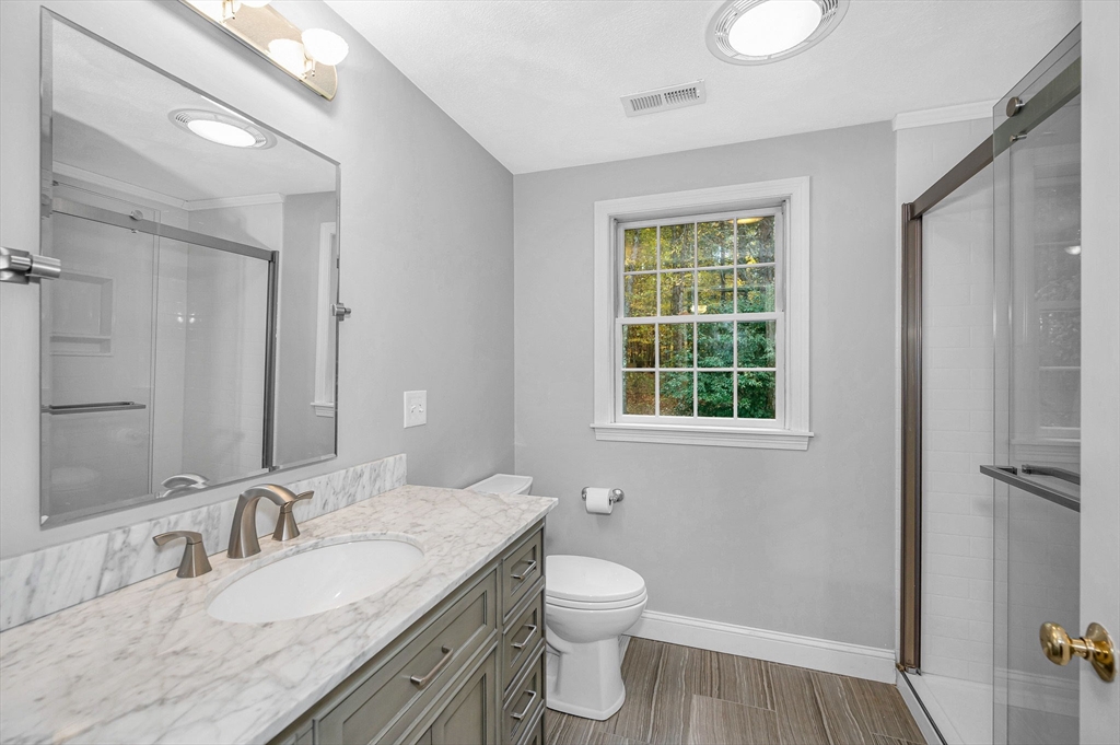 4 Coleman Road Newbury, MA 01922 - Photo 31 of 42 a bathroom with a granite countertop sink toilet and shower