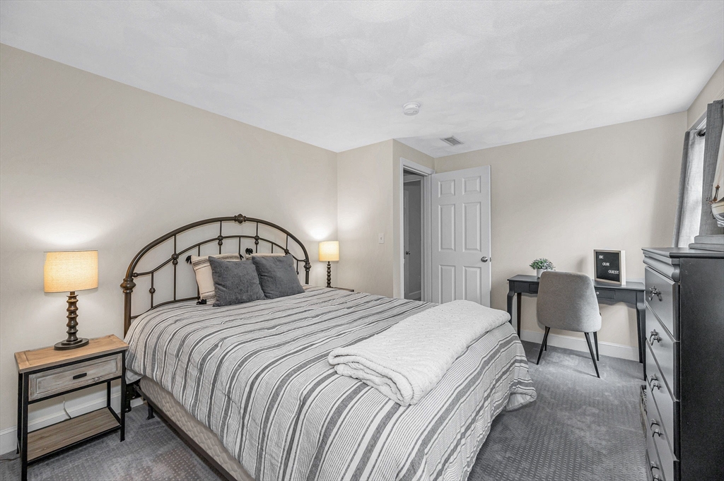 4 Coleman Road Newbury, MA 01922 - Photo 32 of 42 a bedroom with a bed and chair