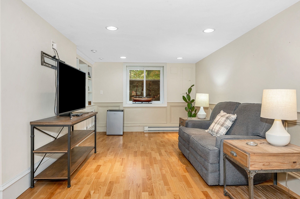 4 Coleman Road Newbury, MA 01922 - Photo 35 of 42 a living room with furniture and a flat screen tv