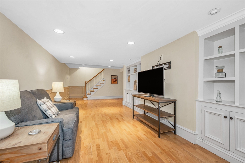 4 Coleman Road Newbury, MA 01922 - Photo 36 of 42 a living room with furniture and a flat screen tv