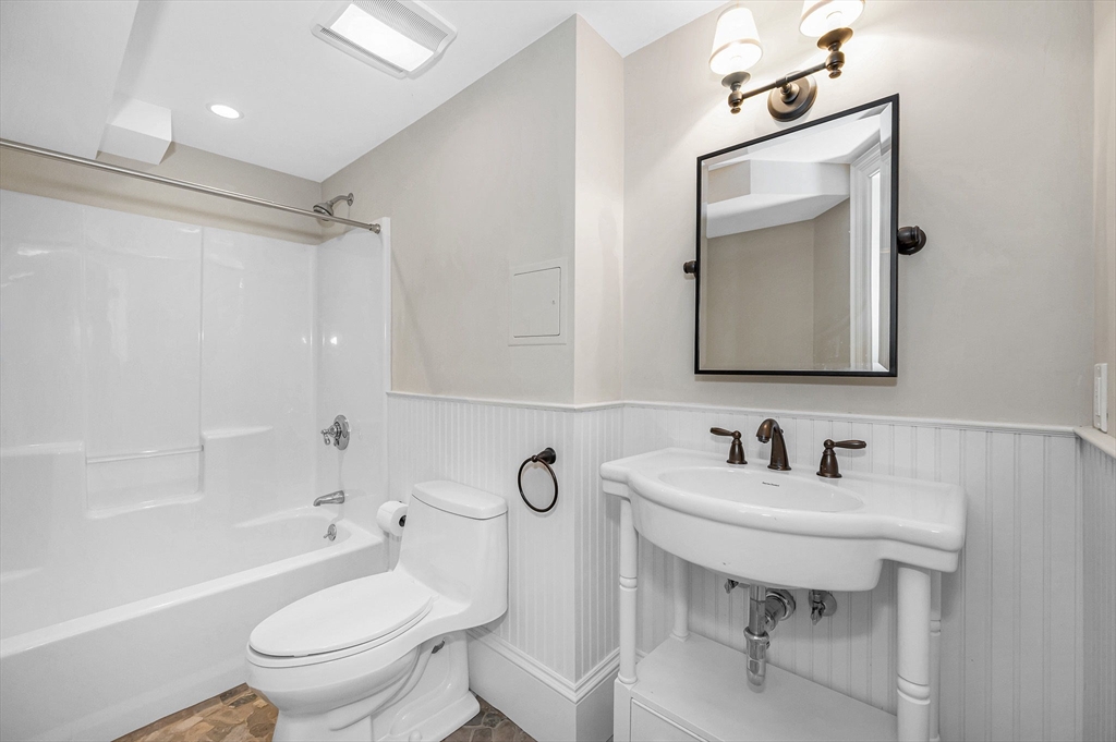 4 Coleman Road Newbury, MA 01922 - Photo 38 of 42 a bathroom with a toilet sink and mirror