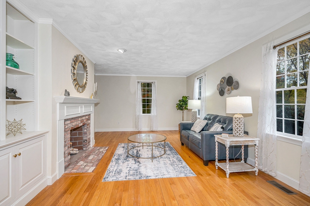 4 Coleman Road Newbury, MA 01922 - Photo 4 of 42 a living room with furniture and a fireplace