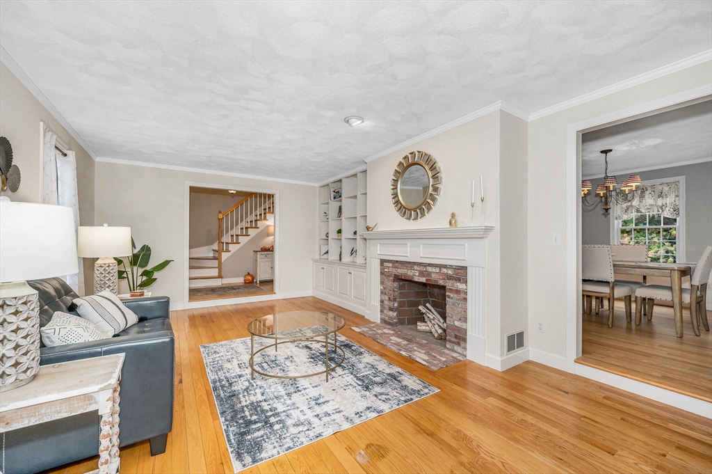4 Coleman Road Newbury, MA 01922 - Photo 5 of 42 a living room with furniture and a fireplace