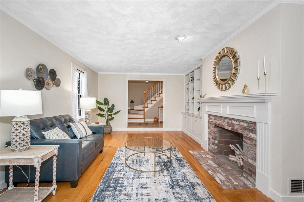 4 Coleman Road Newbury, MA 01922 - Photo 6 of 42 a living room with furniture and a fireplace