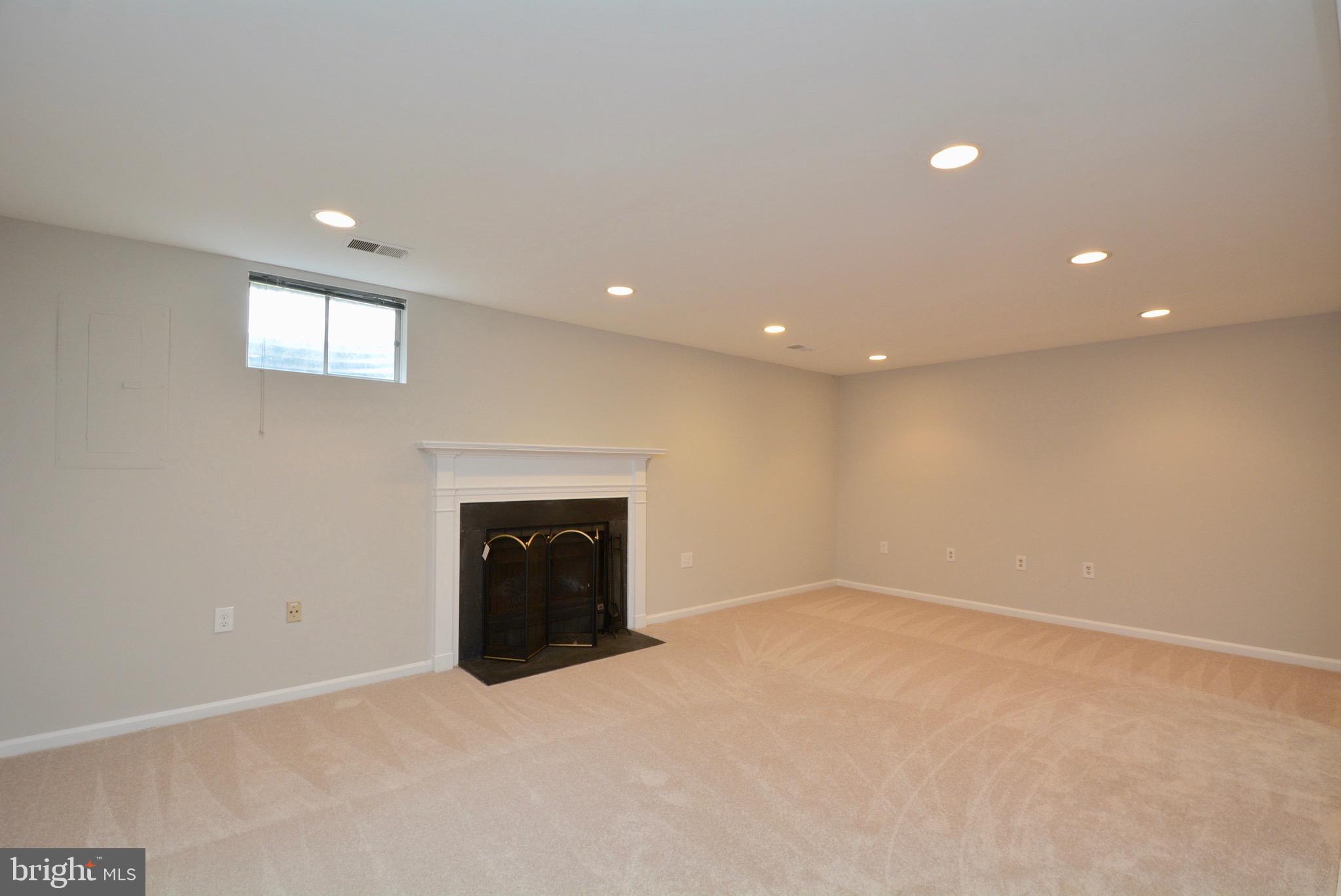 5662 Ridge View Drive Alexandria, VA 22310 - Photo 38 of 43 Wood burning Fireplace on lower level
