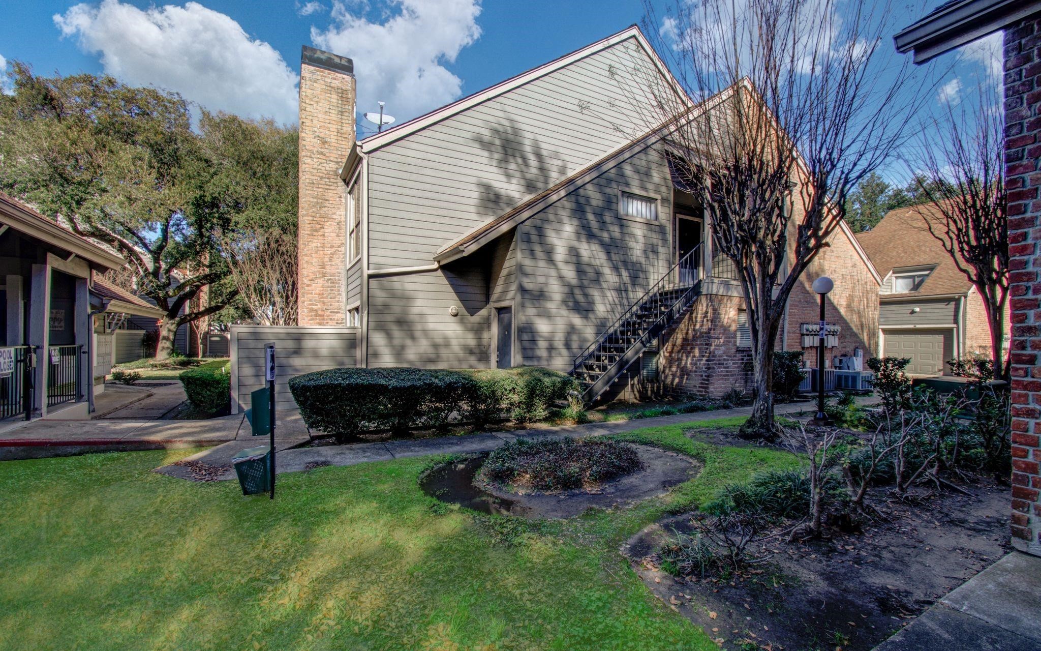 6601 Sands Point Drive, Unit 34 Houston, TX 77074 - Photo 22 of 24 a view of a house with a yard