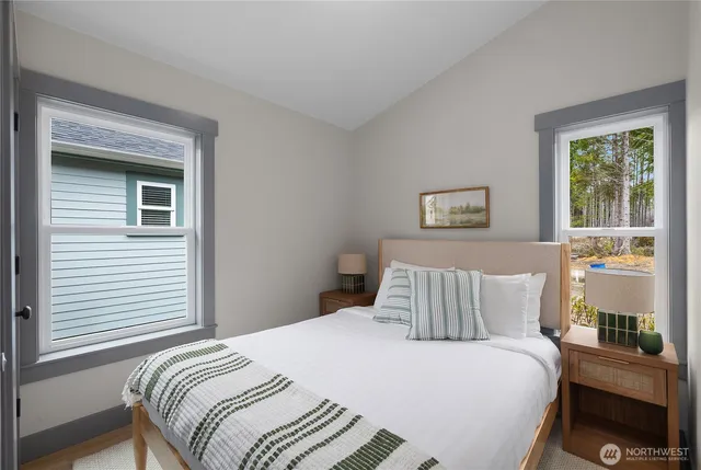 a bedroom with a bed and window