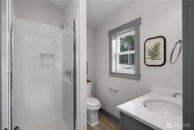 a bathroom with a toilet and a sink