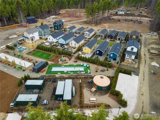 an aerial view of a house with a lake view