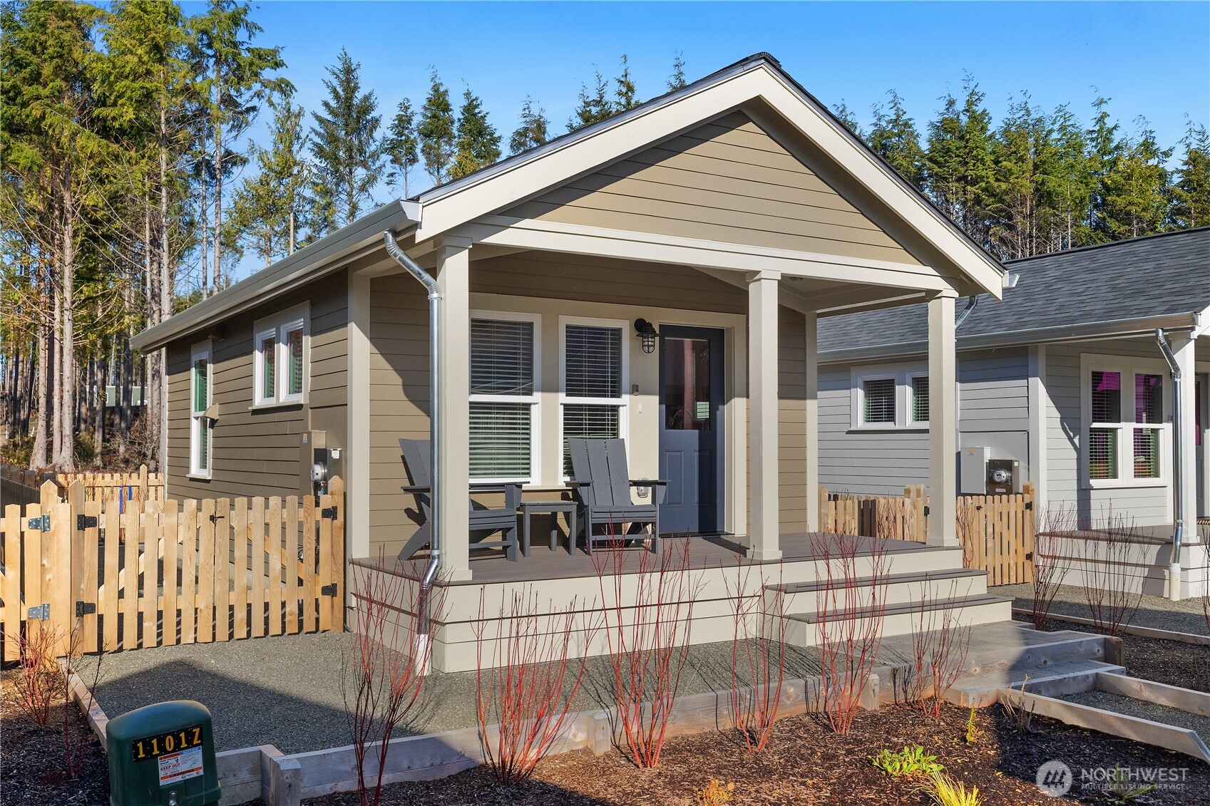 22 Bungalow Loop Pacific Beach, WA 98571 - Photo 2 of 34 a view of a white house with iron fence