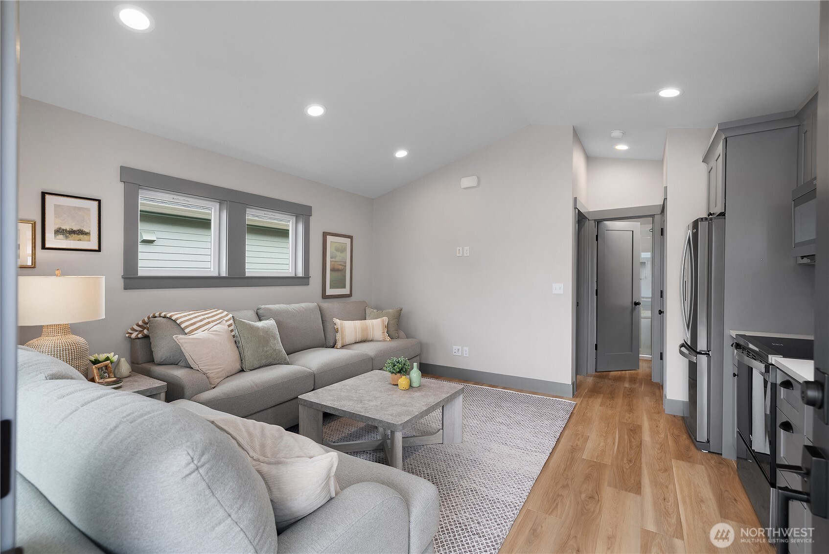 22 Bungalow Loop Pacific Beach, WA 98571 - Photo 5 of 34 a living room with furniture and a wooden floor