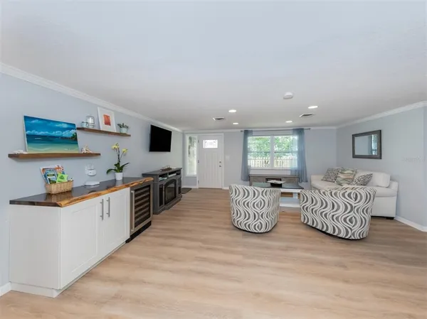a kitchen with a refrigerator and a microwave