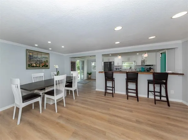 a kitchen with stainless steel appliances a refrigerator sink and cabinets