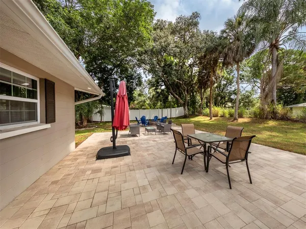 a view of a room with wooden floor and a outdoor space
