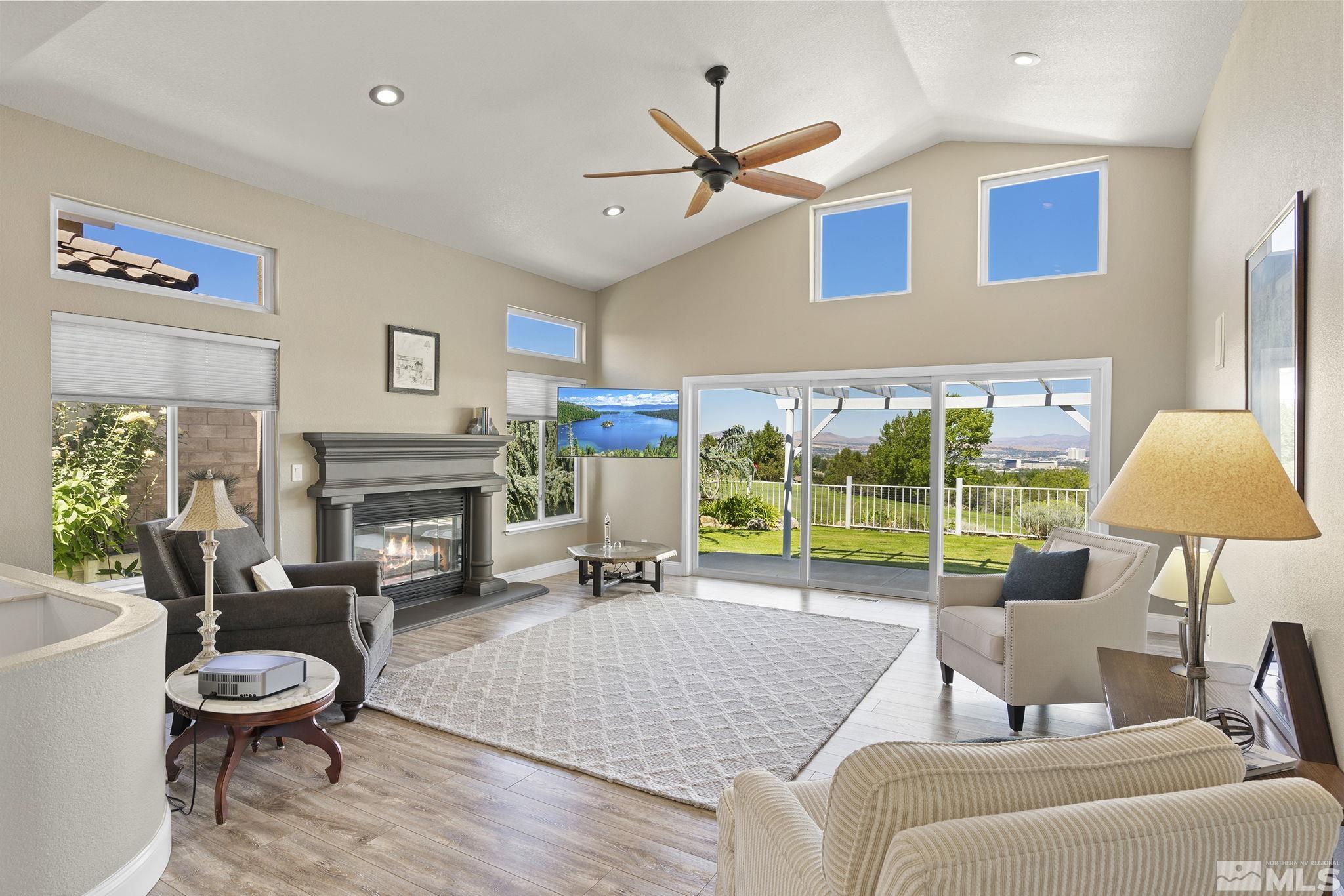2553 Granite Springs Road Reno, NV 89519 - Photo 13 of 38 a living room with furniture and a floor to ceiling window