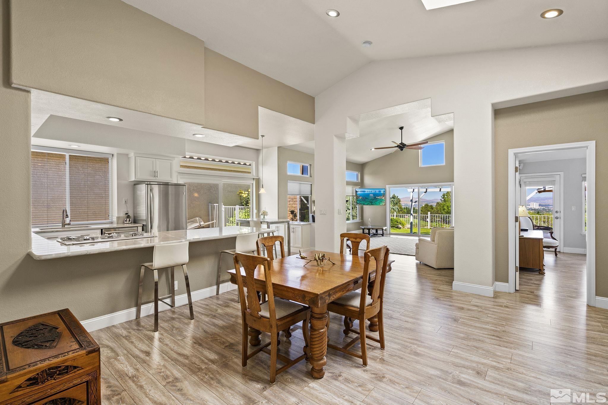 2553 Granite Springs Road Reno, NV 89519 - Photo 14 of 38 a view of a dining room with furniture and wooden floor
