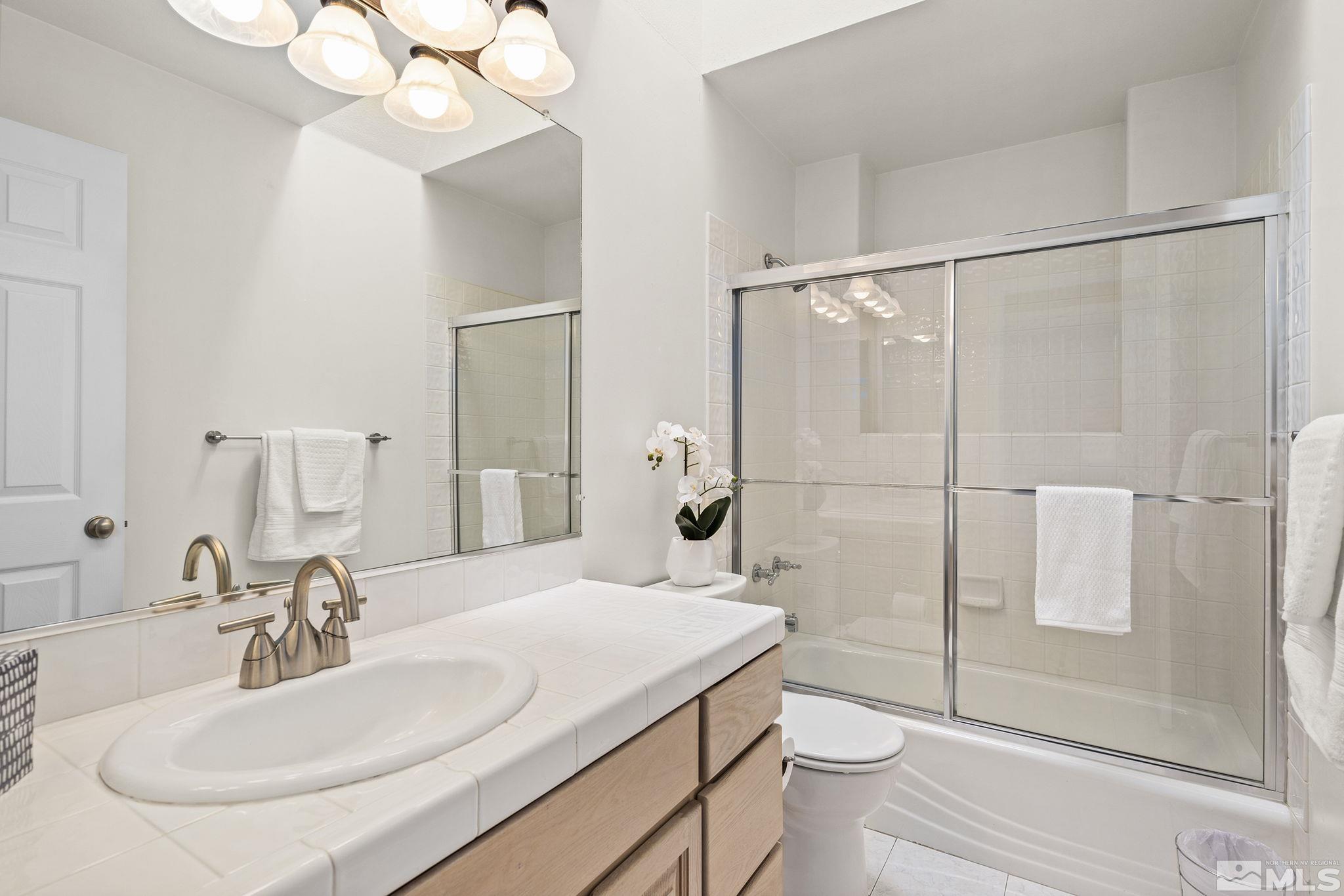 2553 Granite Springs Road Reno, NV 89519 - Photo 26 of 38 a bathroom with a sink toilet and shower
