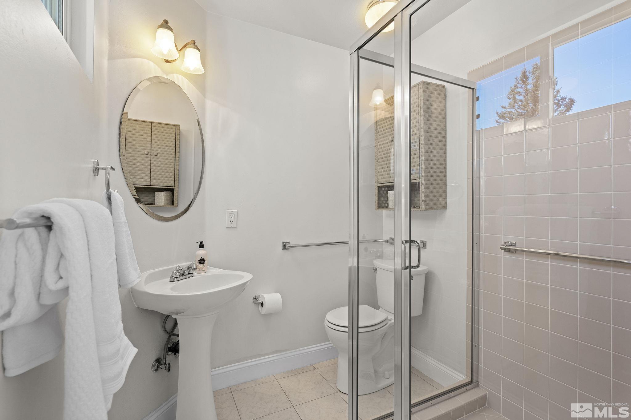 2553 Granite Springs Road Reno, NV 89519 - Photo 28 of 38 a bathroom with a sink a toilet and shower