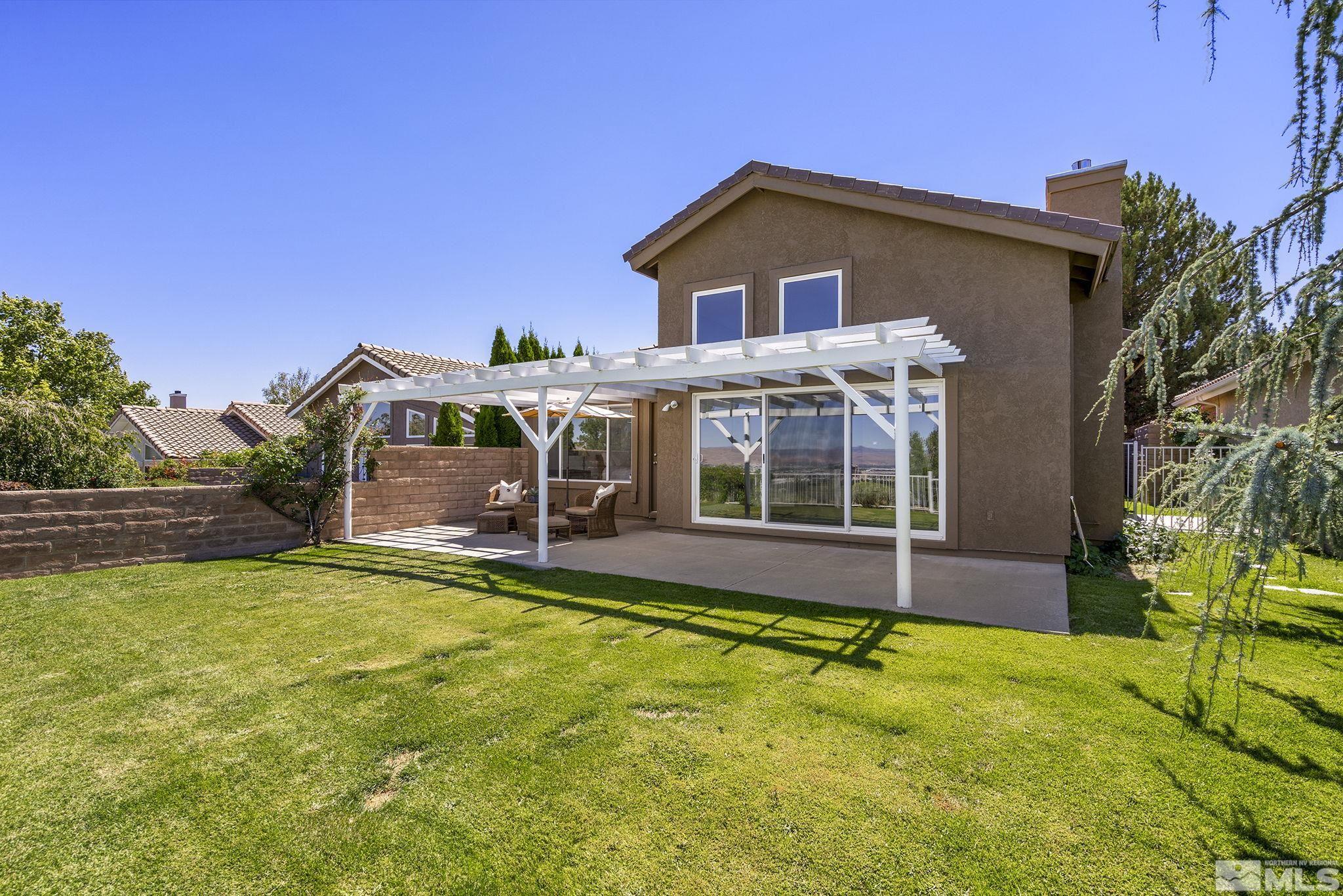 2553 Granite Springs Road Reno, NV 89519 - Photo 31 of 38 a view of a house with pool and a yard