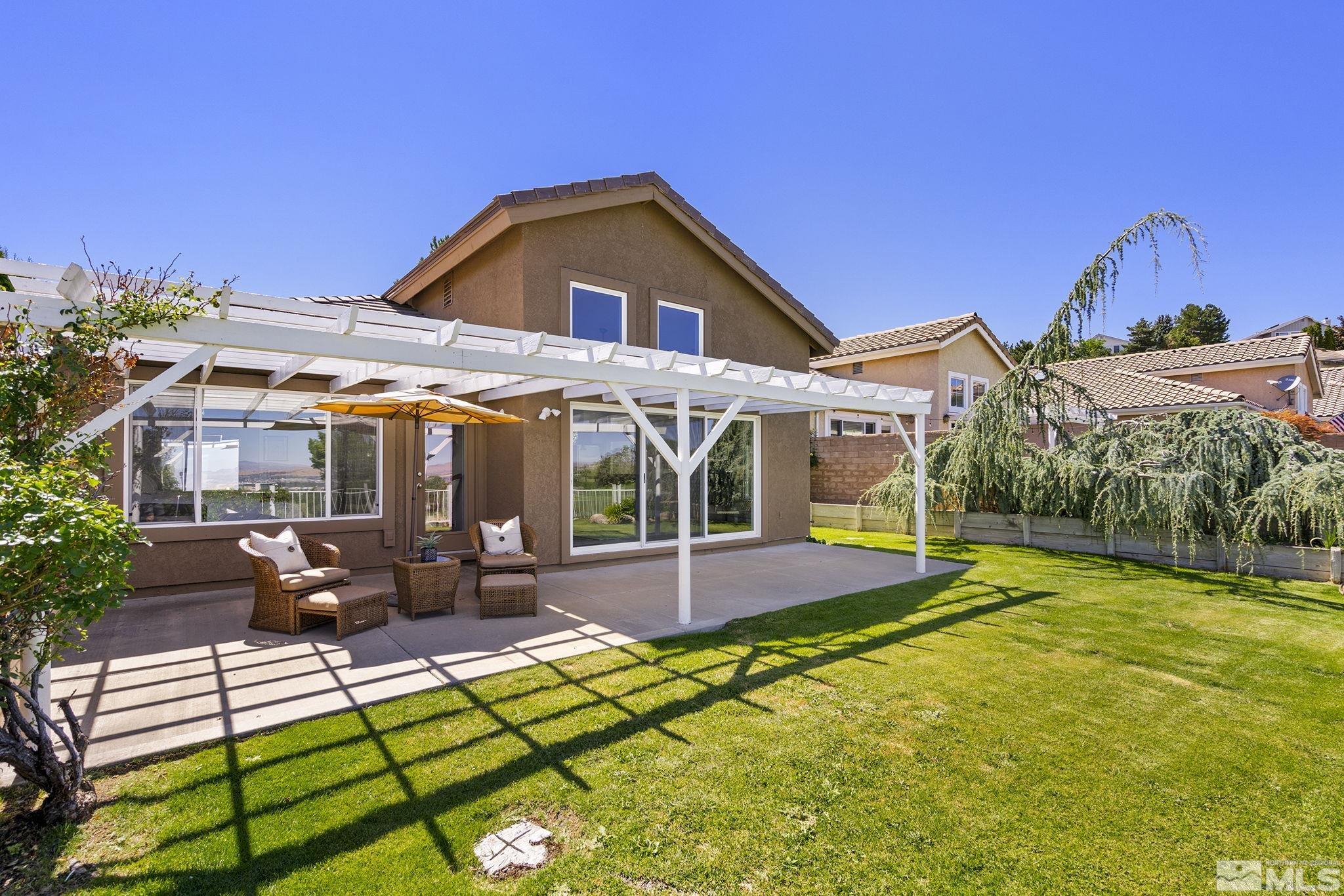 2553 Granite Springs Road Reno, NV 89519 - Photo 34 of 38 a view of a house with swimming pool and sitting area