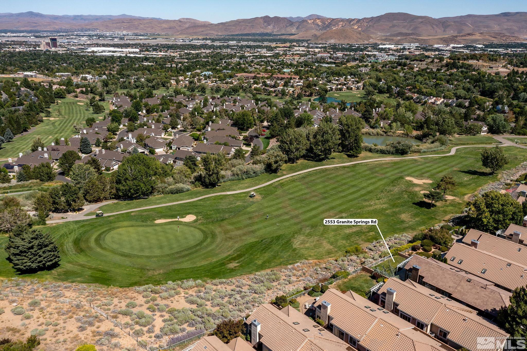 2553 Granite Springs Road Reno, NV 89519 - Photo 4 of 38 a view of a town with mountains in the background