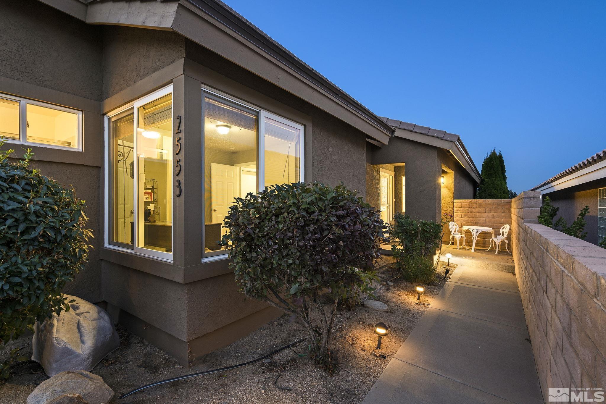 2553 Granite Springs Road Reno, NV 89519 - Photo 8 of 38 a front view of a house with outdoor space