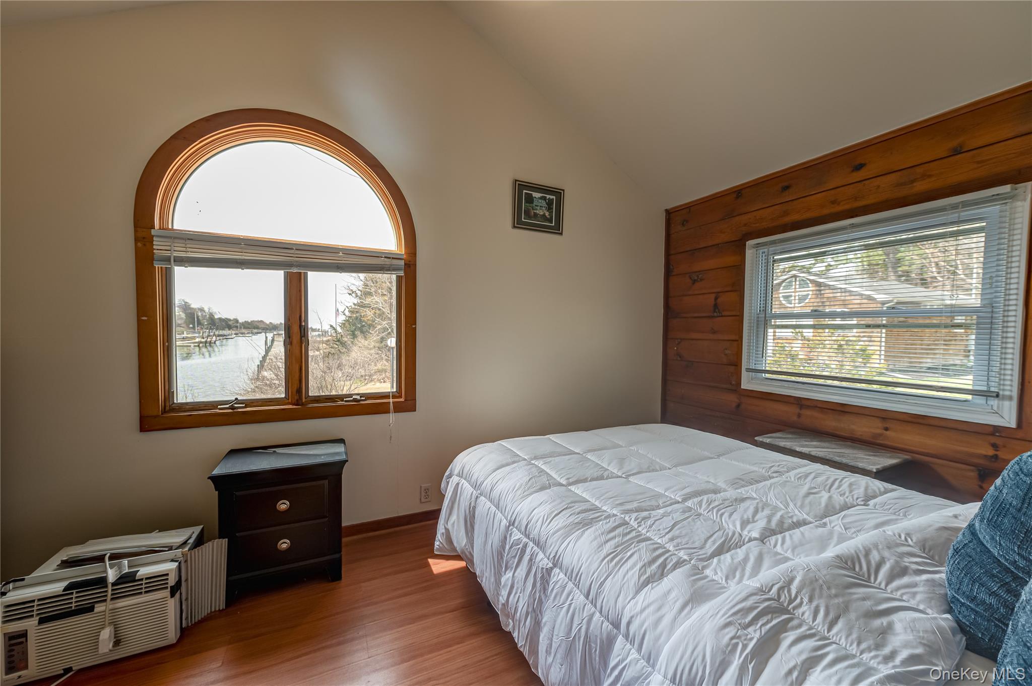 18 Shinnecock Road, Unit 4 Hampton Bays, NY 11946 - Photo 7 of 7 a bedroom with a bed and a window