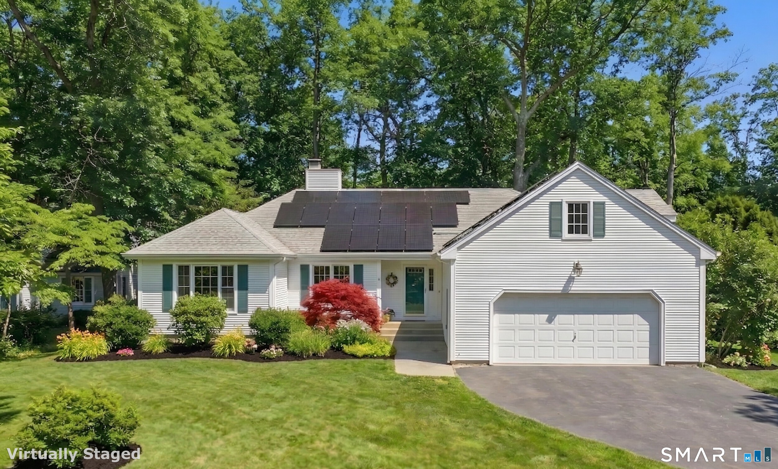 107 Payer Lane Groton, CT 06355 - Photo 1 of 1 a front view of a house with a garden and plants