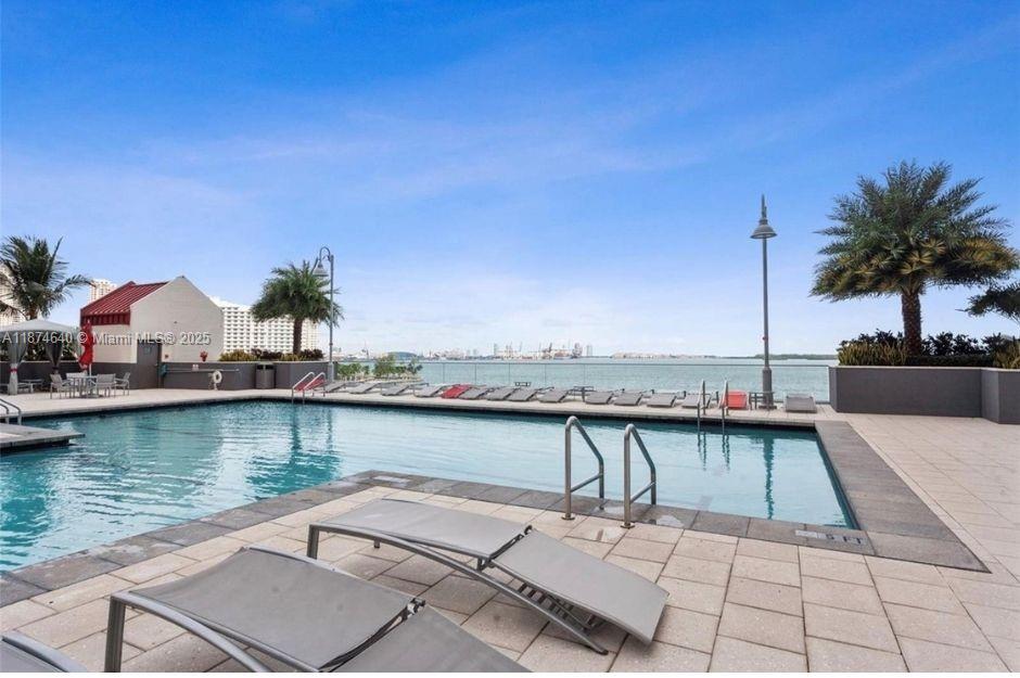 1155 Brickell Bay Drive, Unit 1705 Miami, FL 33131 - Photo 7 of 8 a view of a terrace with chairs