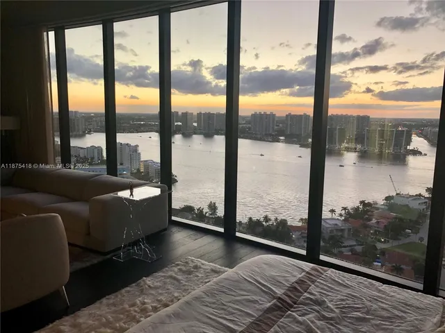 a bathroom with a double vanity sink a toilet and a mirror