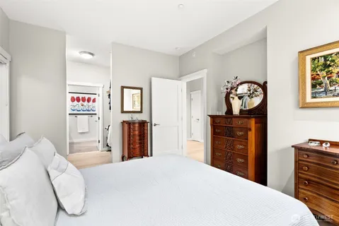 a bedroom with a bed and a dresser