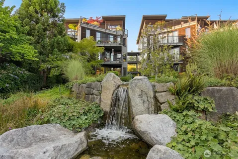 a view of a house with a yard and balcony