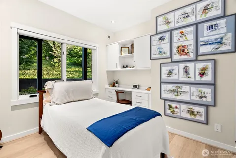 a bedroom with a large bed and a window