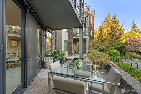 a dining room with furniture and garden view