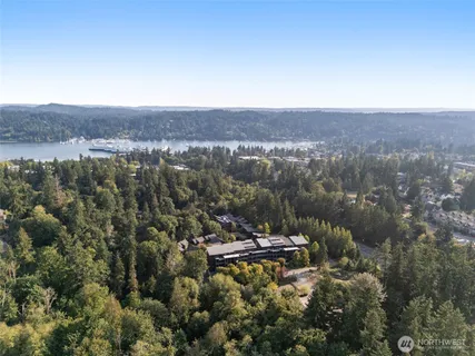 an aerial view of house with yard and mountain view