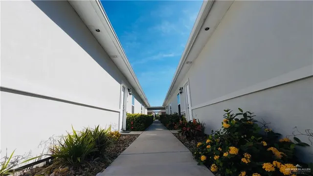 a view of a house with a flower garden