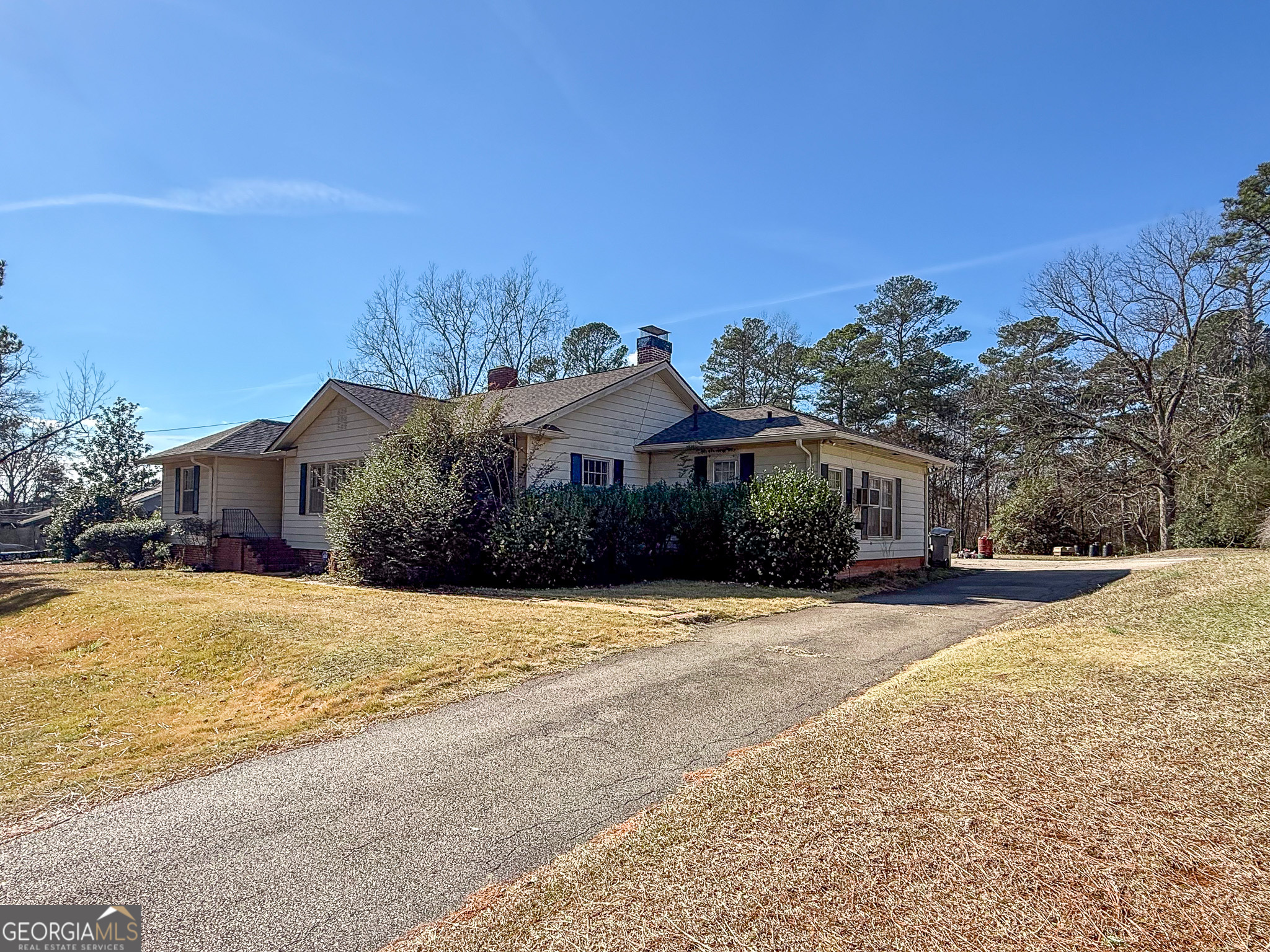 509 Youngs Mill Road LaGrange, GA 30241 - Photo 2 of 28 a front view of a house with a yard covered with trees