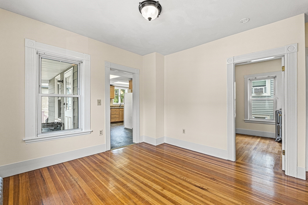 16 Porter Street, Unit 2 Somerville, MA 02143 - Photo 16 of 26 a view of empty room with wooden floor and fan