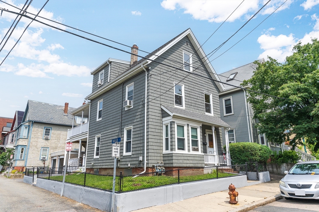 16 Porter Street, Unit 2 Somerville, MA 02143 - Photo 2 of 26 a front view of a building with street
