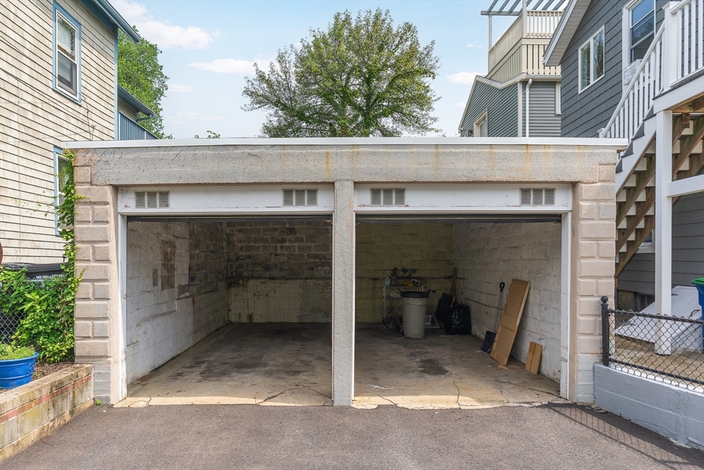 16 Porter Street, Unit 2 Somerville, MA 02143 - Photo 3 of 26 a view of a patio with table and chairs and potted plants