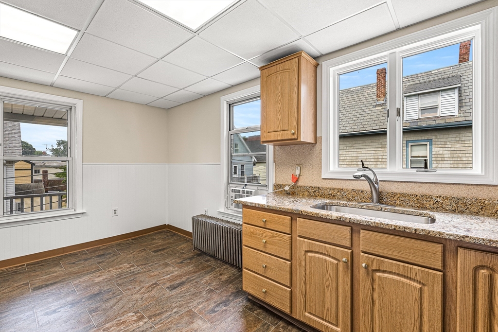 16 Porter Street, Unit 2 Somerville, MA 02143 - Photo 7 of 26 a kitchen with sink and cabinets