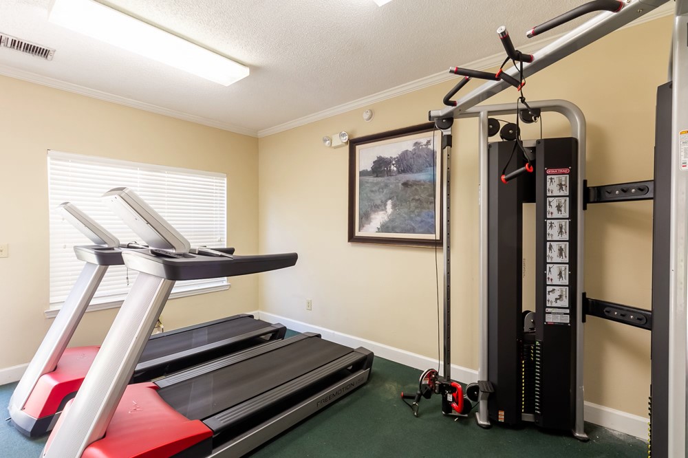 835 Oglethorpe Avenue Southwest Atlanta, GA 30310 - Photo 13 of 39 a room with gym equipment and a window